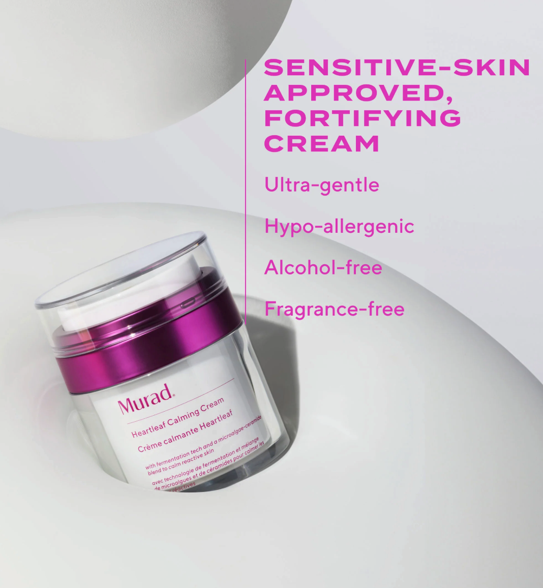 Jar of sensitive skin cream with purple and white design on a light gray background